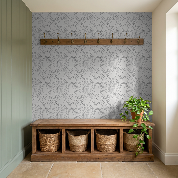 Floral lineart wallpaper in a modern entryway with wooden bench and plants.